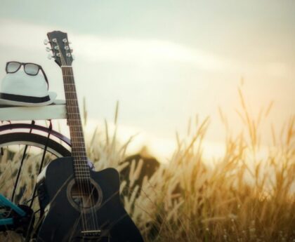 bicycle,hat, sunglasess and guitar
